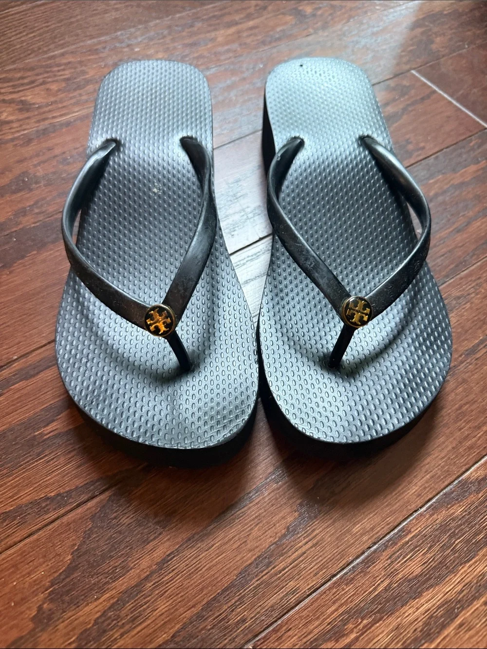 Tory Burch Black Flip Flop Sandals with Gold Logo Medallion